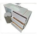 White dressing table with storage drawers pulled open, overhead view