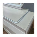 White dressing table top edge and mirror base close-up