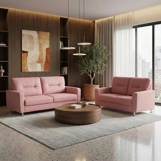 Pink Elara fabric sofas with chrome legs in a modern living room