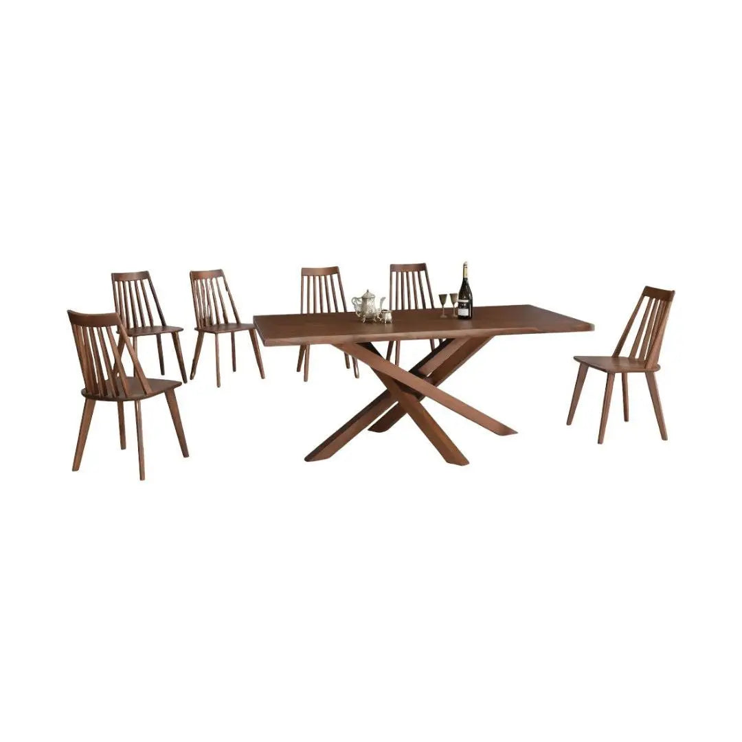 Walnut dining table with crossed base and six spindle-back chairs