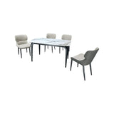 White stone-patterned dining table with four grey chairs