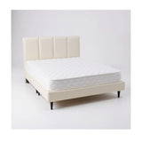 Cream upholstered bed with vertically panelled headboard and white mattress