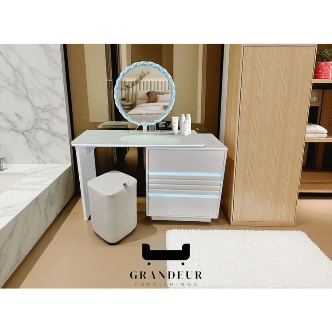 White dressing table with decorative illuminated oval mirror in a bedroom