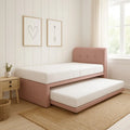 Pink Alvera guest bed with trundle extended beside a window