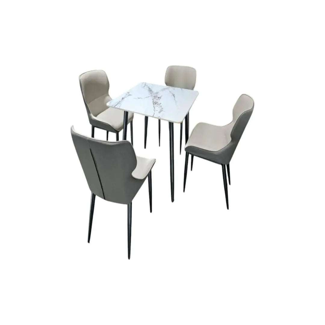 Square white stone-patterned dining table with four grey chairs