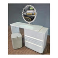 White dressing table with decorative oval mirror, angled view