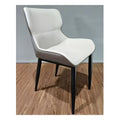 Beige upholstered dining chair with dark metal legs