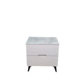 White bedside table with grey stone-patterned top and dark legs