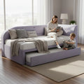 Adult and child on lilac corner daybed with trundle extended