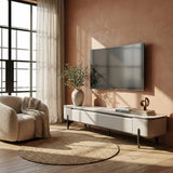 Pale Pristine TV console with tall dark legs beside a window
