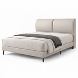 Beige upholstered bed with split padded headboard and black legs