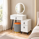 White dressing table with round mirror, side storage cabinet and patterned stool in a bedroom