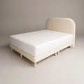 Cream Sorella bed with rounded headboard, angled view