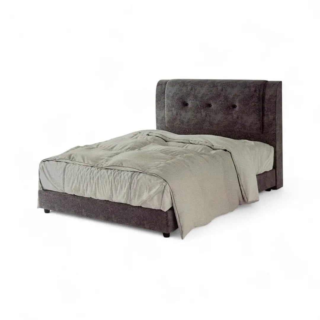 Dark grey upholstered bed with deep button-tufted headboard