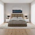 Brown upholstered bed, front view beneath a framed picture