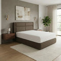 Brown Avalise bed beside a bedside cabinet