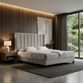 Light grey Seraph bed beside a large window
