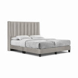 Light grey Seraph upholstered bed with tall fluted wingback headboard