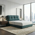 Teal Verity bed beside floor-height windows