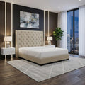 Beige Aurette bed in a bedroom at dusk