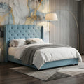 Blue Calista bed against a stone-patterned feature wall