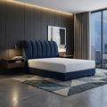 Navy Amora bed beside a window at dusk