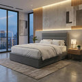 Charcoal Estoria bed with bedding beside a window at dusk