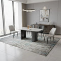 White dining table with upholstered chairs in a dining room