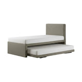 Grey upholstered guest bed with lower pull-out trundle