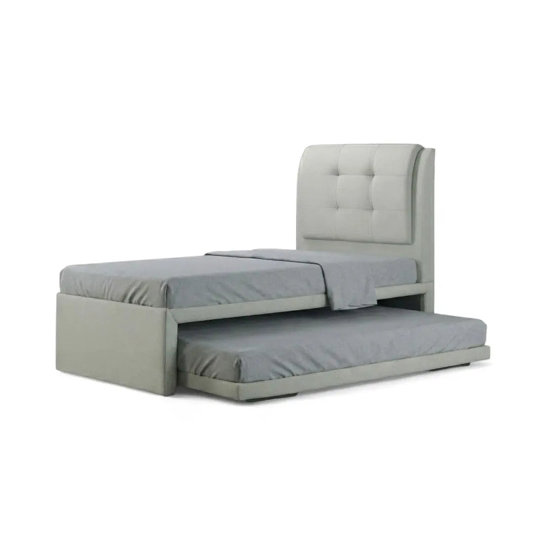 Pale Soluxe guest bed with square-tufted headboard and lower trundle