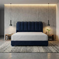 Navy Amora bed, front view beneath wall lights