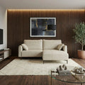 Cream Valentina sofa and ottoman in a softly lit living room